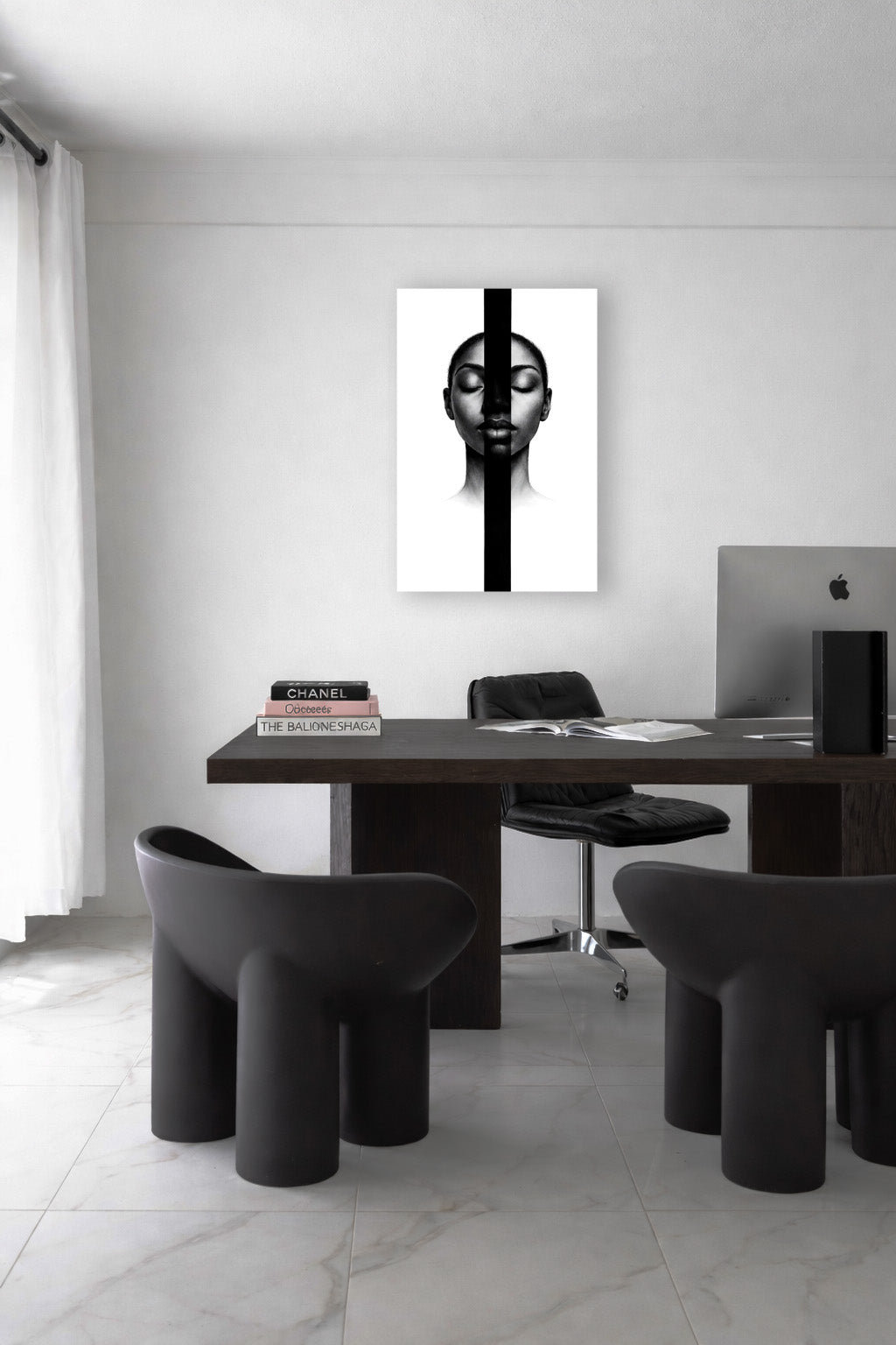 Minimal black portrait wall art featured in a bright home office with modern furniture, soft natural light, and a clean monochrome aesthetic.