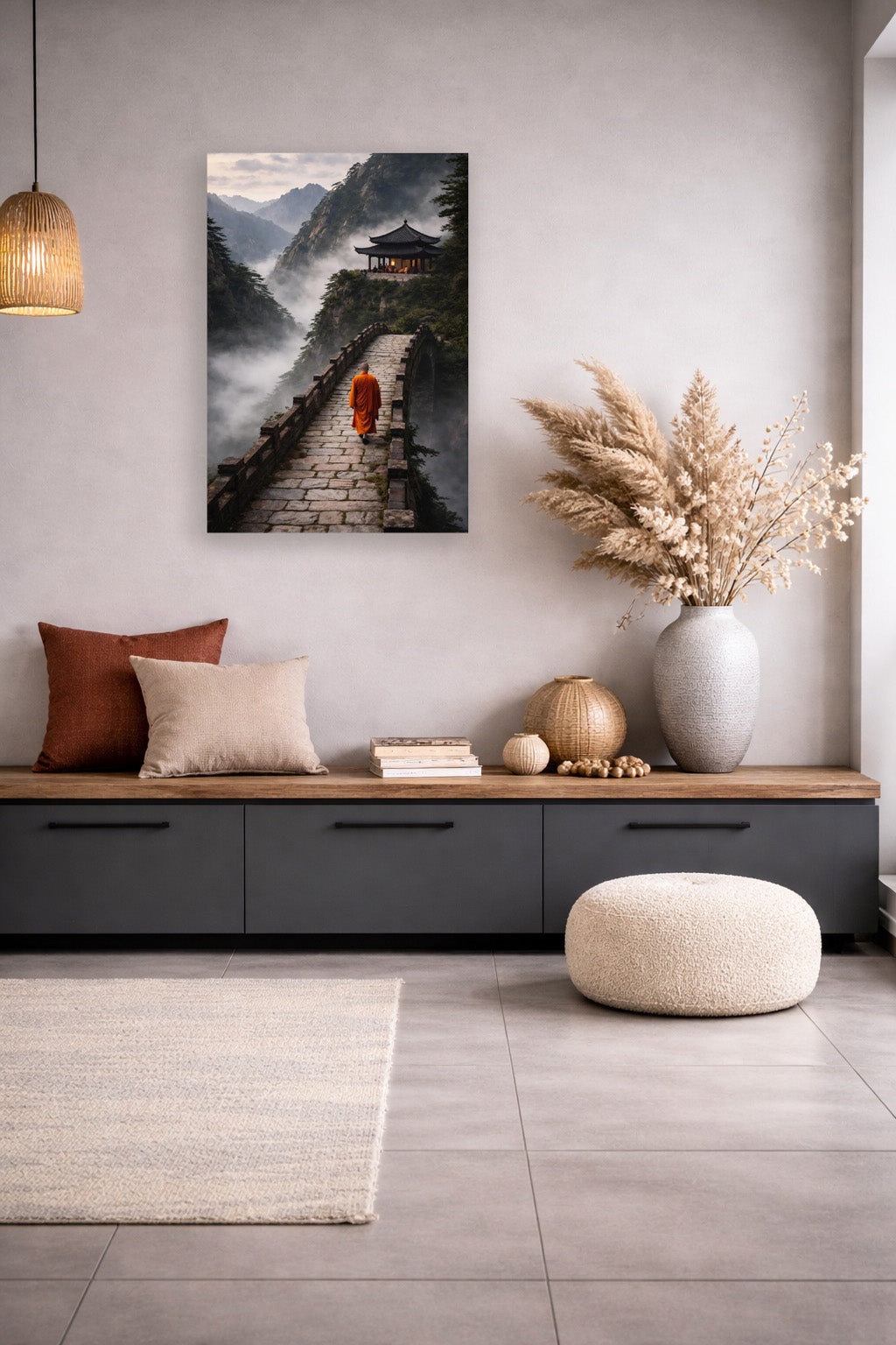 Modern japandi lounge with warm neutral decor and mountain monastery wall art poster above low cabinet.