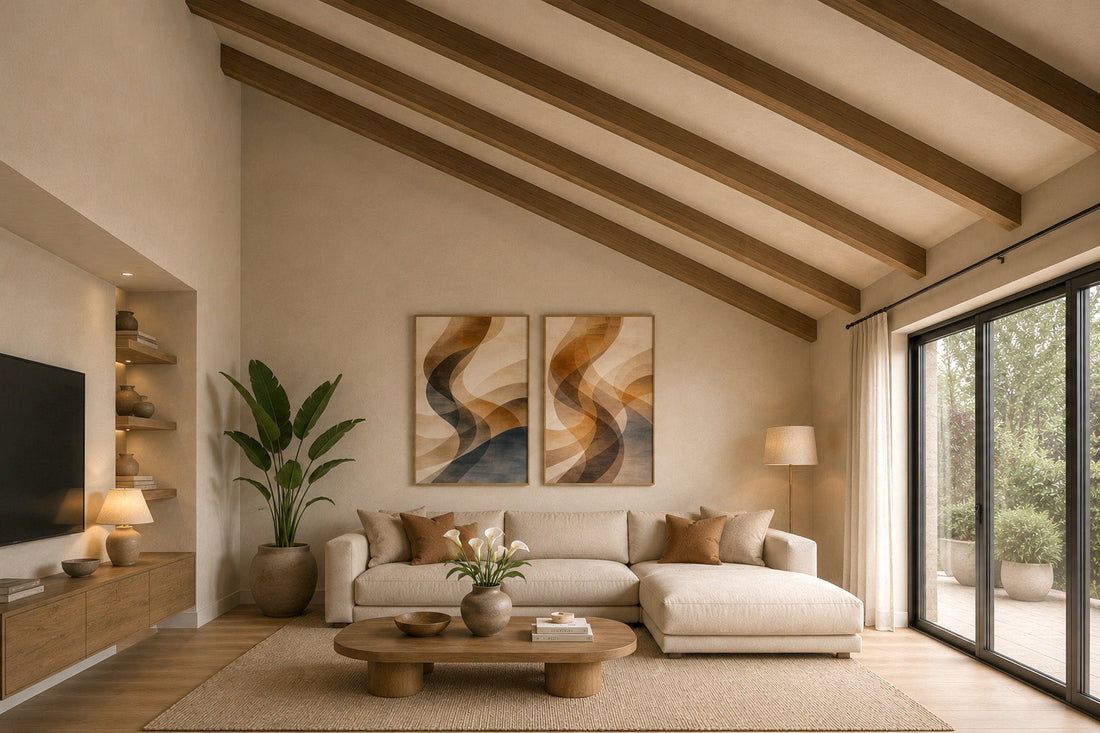 Two framed abstract prints above a sofa in a living room with a vaulted ceiling
