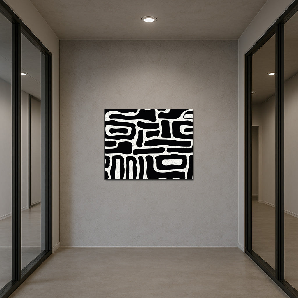 Minimalist black and white abstract wall art displayed in a modern office workspace