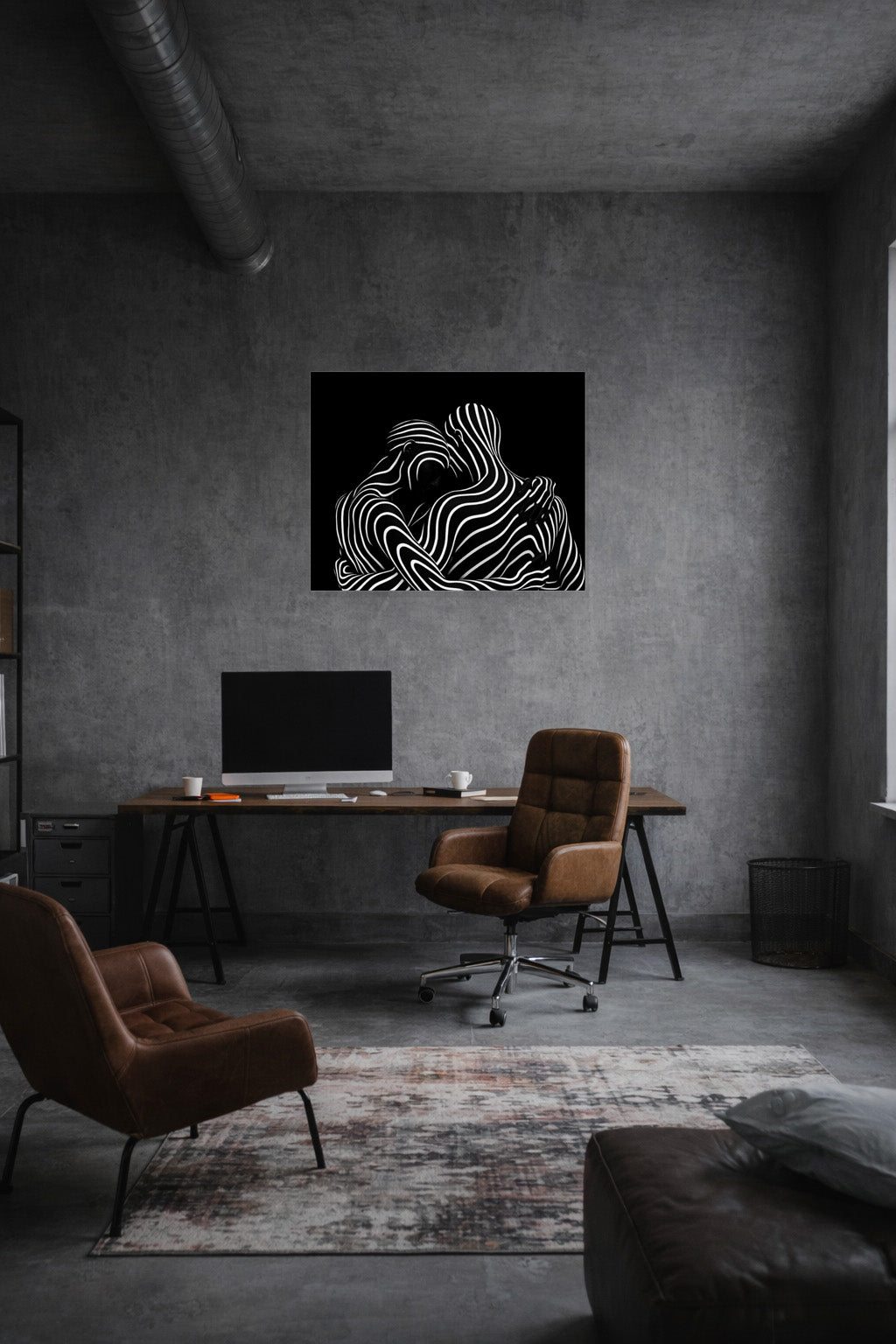 Abstract black and white canvas wall art displayed in a modern dark living room interior
