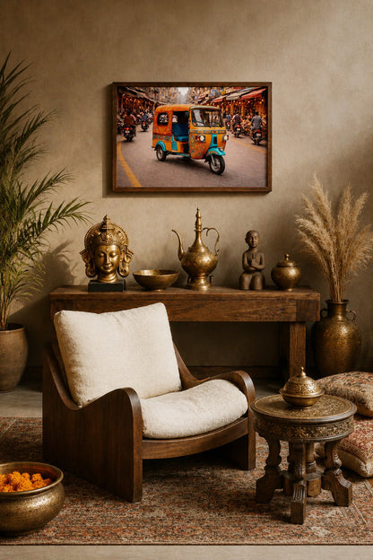 Tuk tuk market wall art with dark wood frame styled in an Indian-inspired interior with brass decor, wooden furniture and neutral tones.