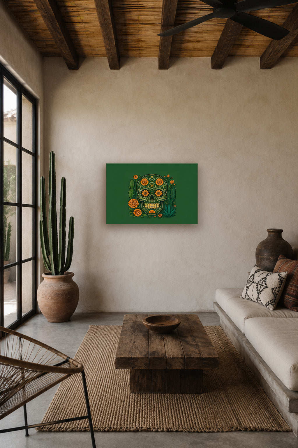 Mexican hacienda style living room with wooden ceiling beams, neutral sofa and green sugar skull artwork displayed on a textured wall.