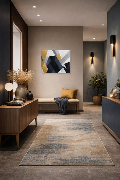 Geometric canvas wall art in a warm living room with a beige sofa and wall lights