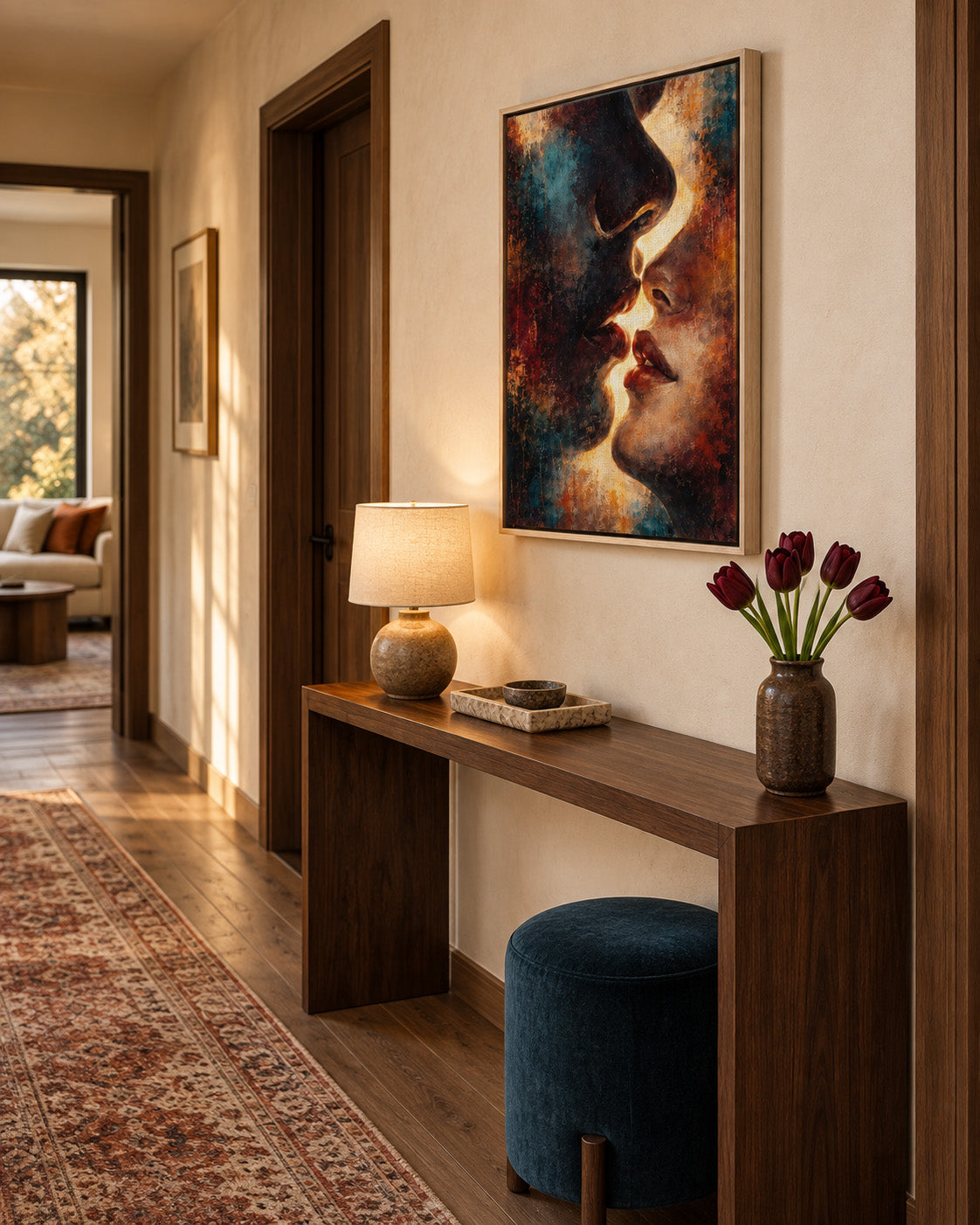 Between Shadow & Gold abstract portrait framed canvas displayed above a console in a warm modern entryway