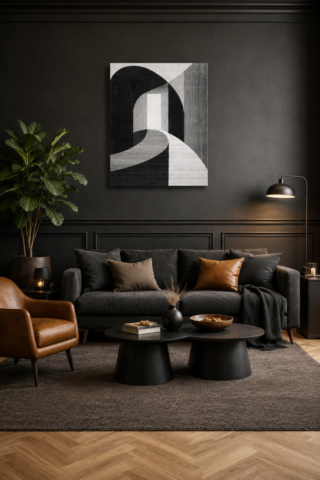 Minimalist black abstract canvas wall art in a dark modern living room with leather chair and charcoal walls