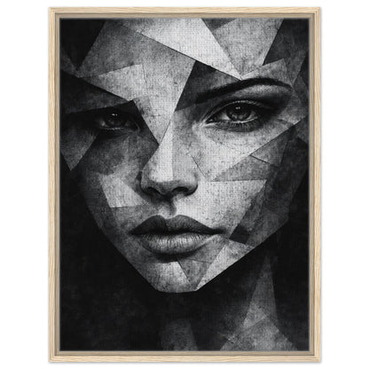 Black and white female face artwork with angular forms in light wood frame