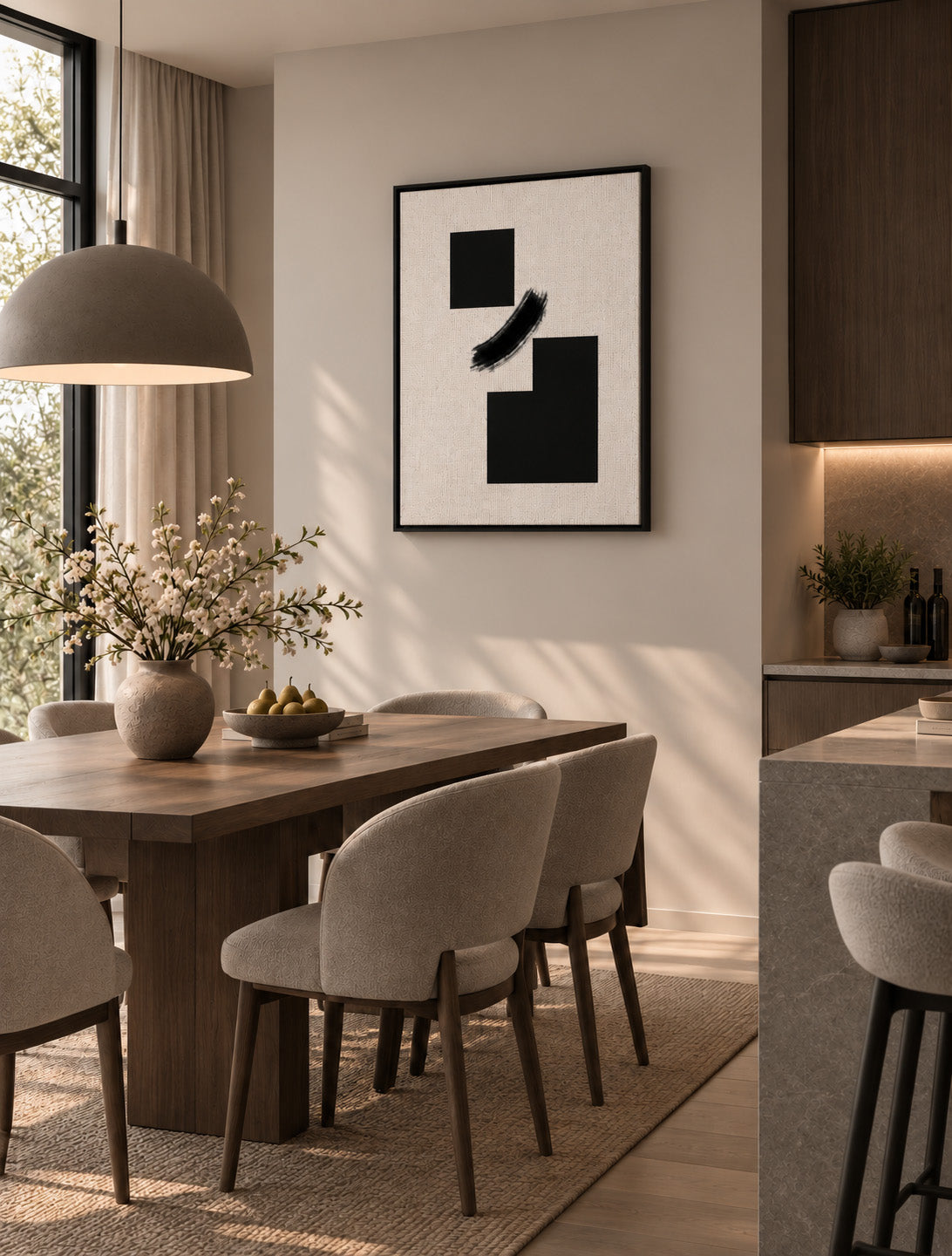 Bold geometric wall art styled in an elegant minimalist dining room