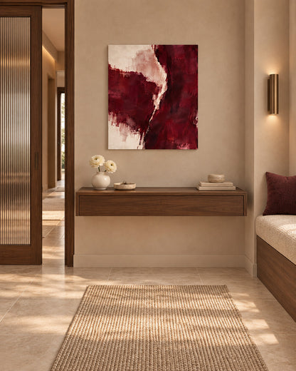 Burgundy Gesture abstract canvas above a floating wooden console in a hallway with a built-in bench