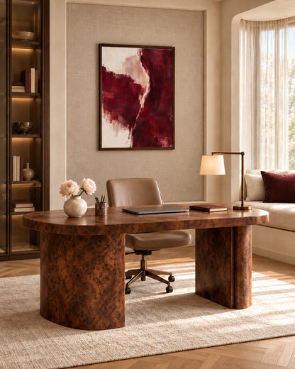 Burgundy Gesture abstract canvas in a dark wood frame above a wooden desk in a home office