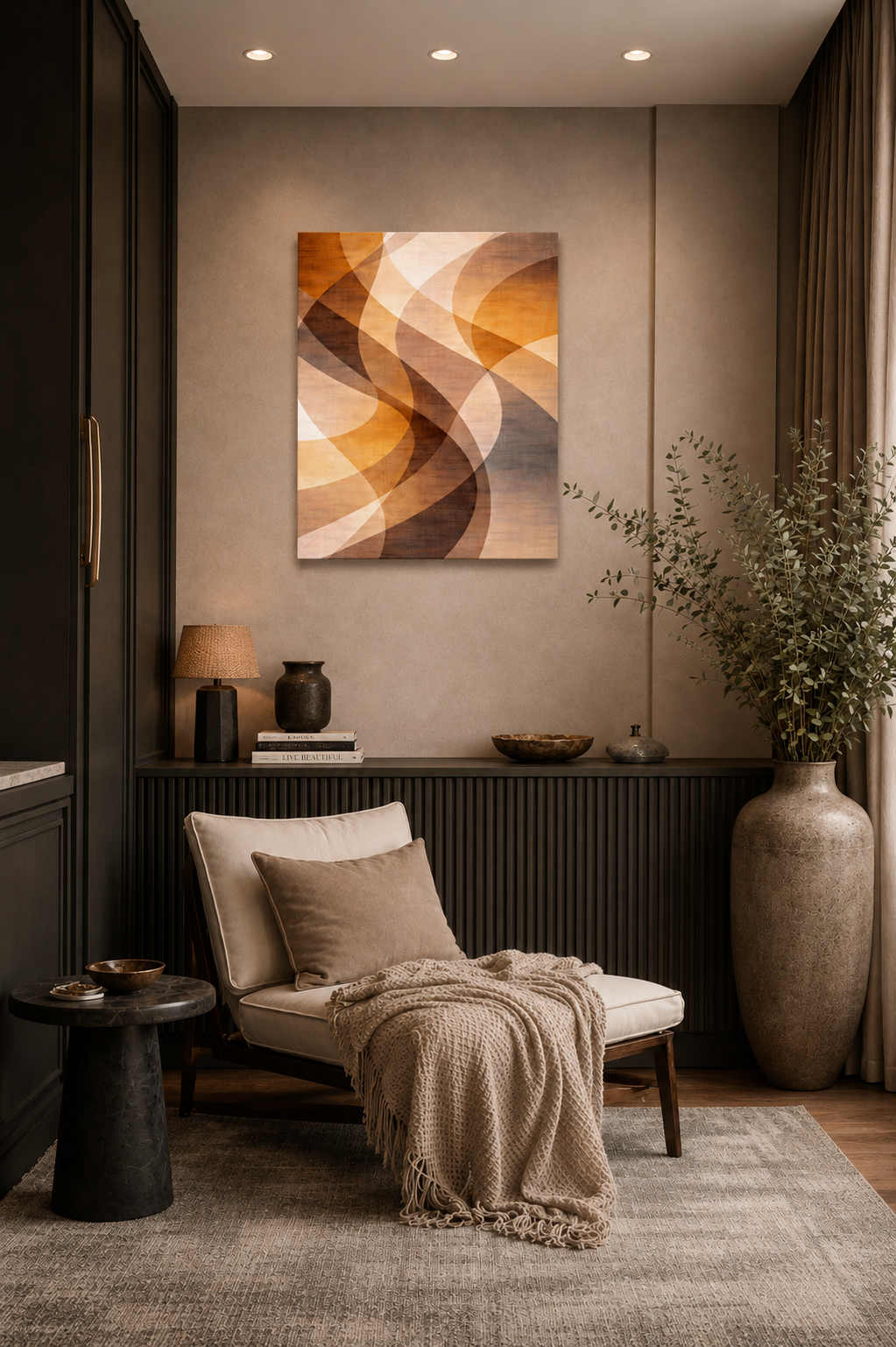 Cozy reading nook with lounge chair and abstract canvas wall art in warm neutral tones