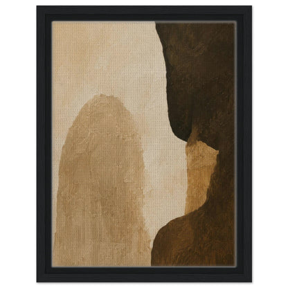 Earth tone abstract print featuring beige brown and charcoal forms in black frame