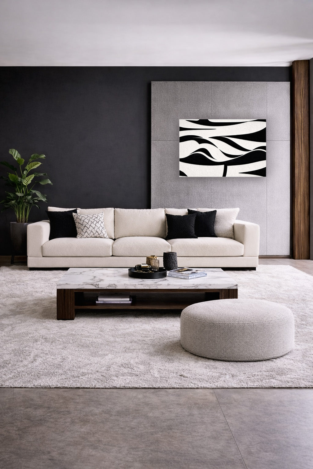 Black and white abstract wall art poster in a bright modern living room with neutral furniture