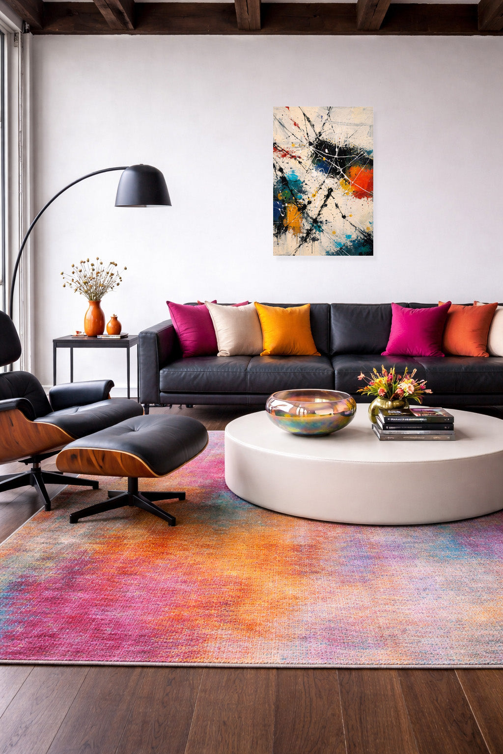 Abstract art poster in a modern living room with a dark sofa, colorful cushions and a patterned rug