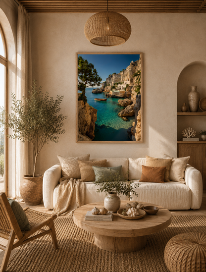Turquoise bay framed wall art above a cream sofa in a living room with a pendant lamp and olive branches