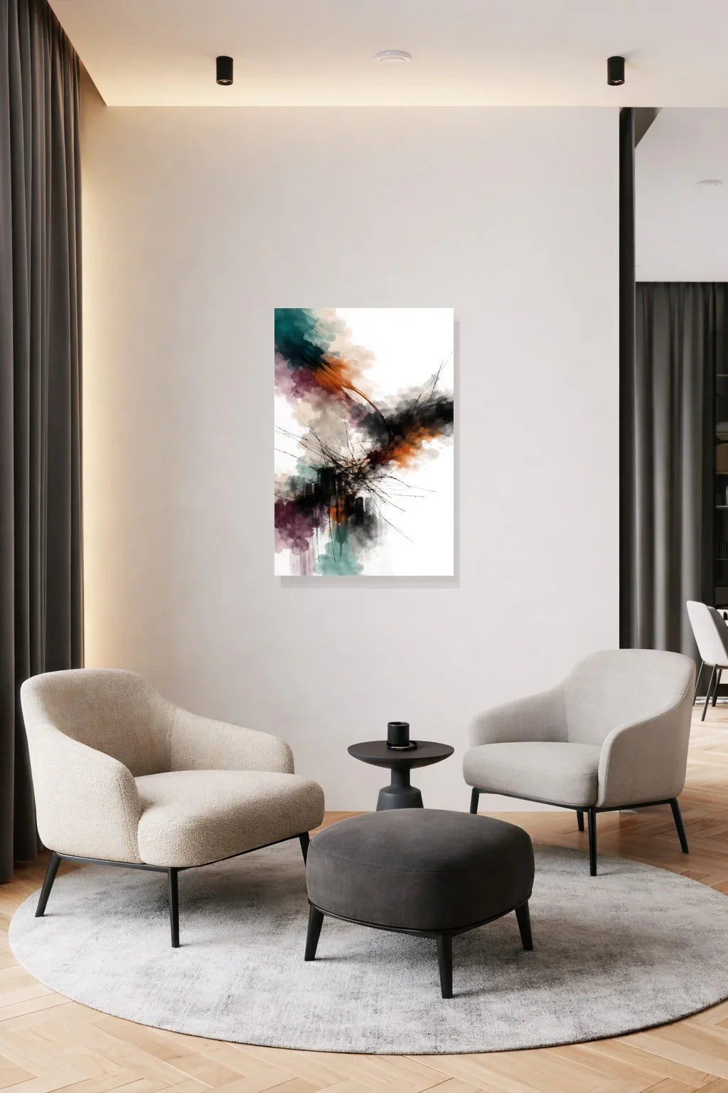 Abstract art poster on a dark wall above two cream armchairs and a round side table