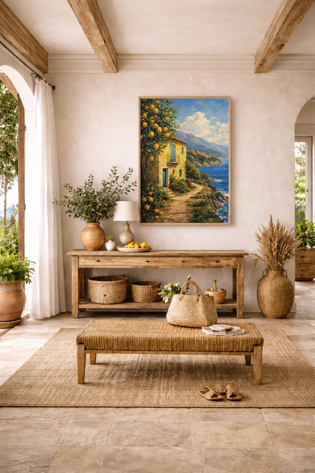 Mediterranean entryway interior with rustic wood console, woven decor and Lemon Coast Path poster in light wood frame above the table.