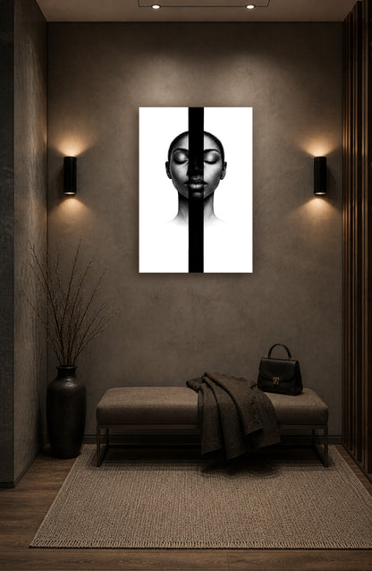 Minimal black portrait wall art displayed above a wooden bench in a calming meditation corner with warm ambient lighting and neutral decor.