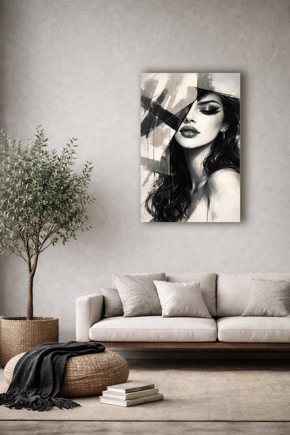 Minimalist living room with beige sofa and natural decor featuring a black and white woman portrait poster on a light textured wall.