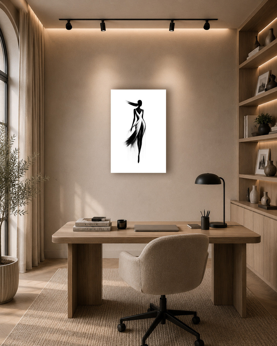 Fashion sketch wall art displayed above a wooden desk in a warm minimalist home office with built-in shelves.