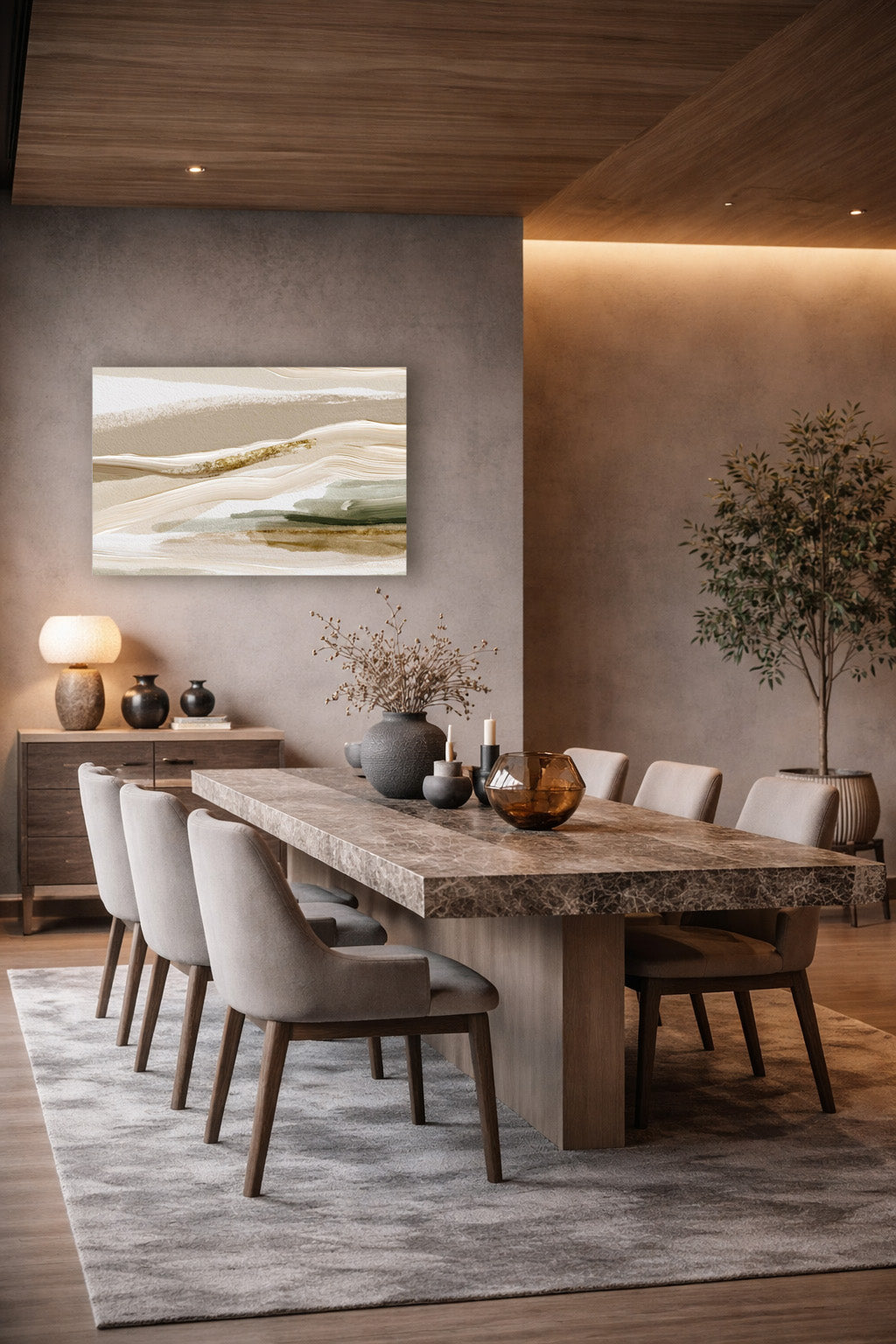 Neutral beige abstract landscape wall art displayed above a dining table in a warm modern dining room.