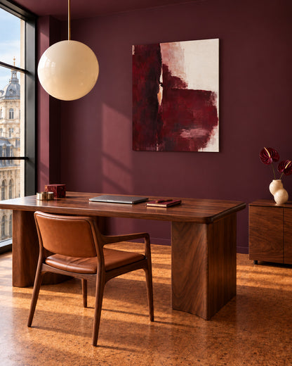 Oxblood Poise burgundy abstract canvas in a home office with plum walls and a wooden desk