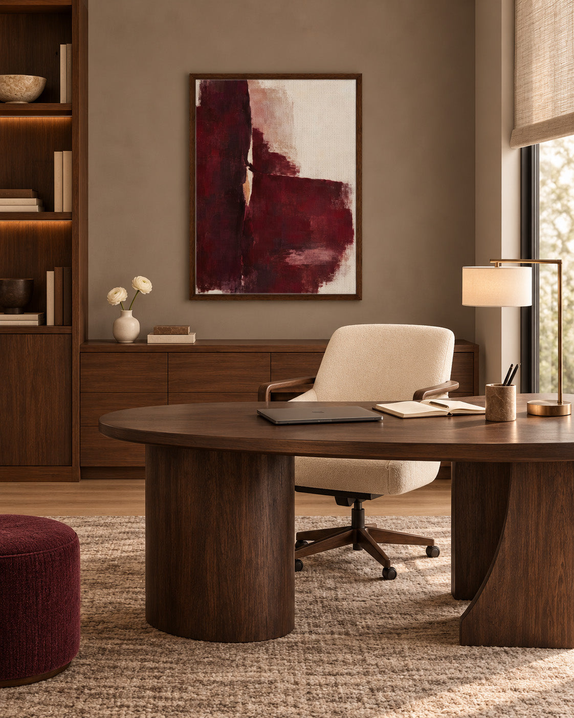Oxblood Poise framed burgundy abstract canvas above a wooden desk with a cream chair in a home office