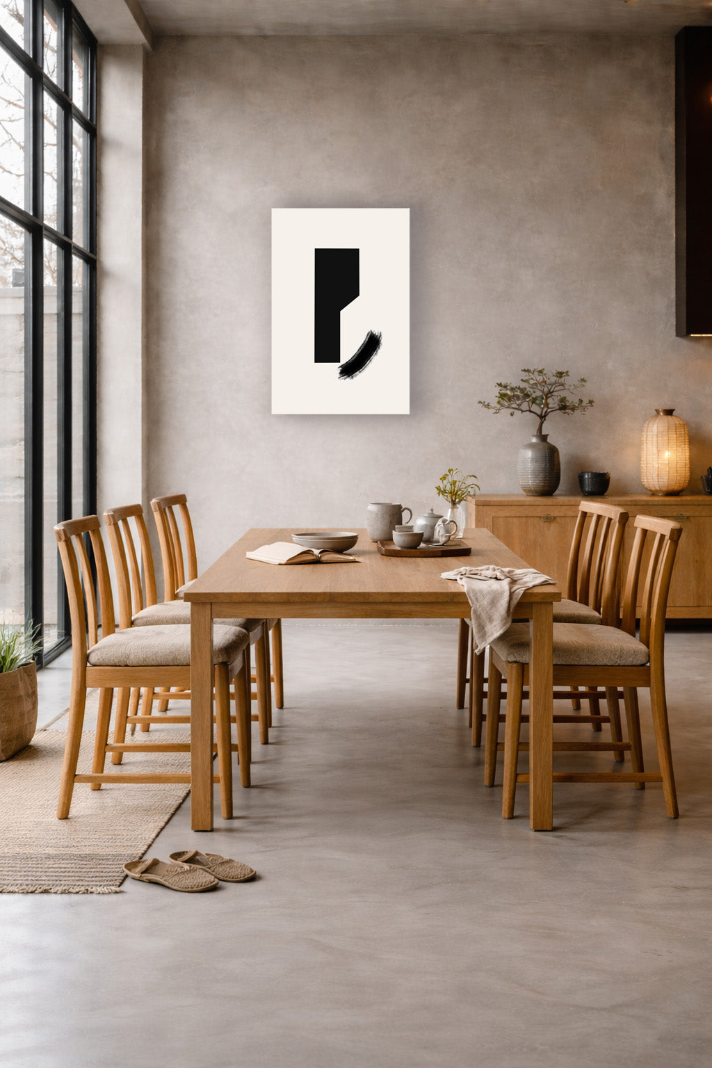 The poster in a dining room with a wooden table and light wood chairs