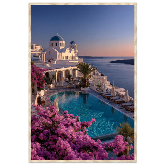 Santorini Blue Hour Greek island sunset framed wall art in a light wood frame, showing blue domes, a pool and bougainvillea above the Aegean