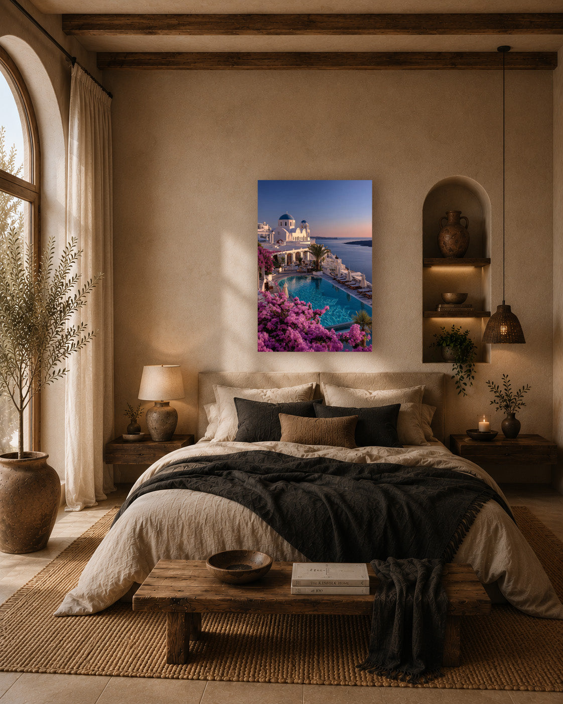 Greek island poster above a bed in a warm bedroom with an arched alcove and layered bedding