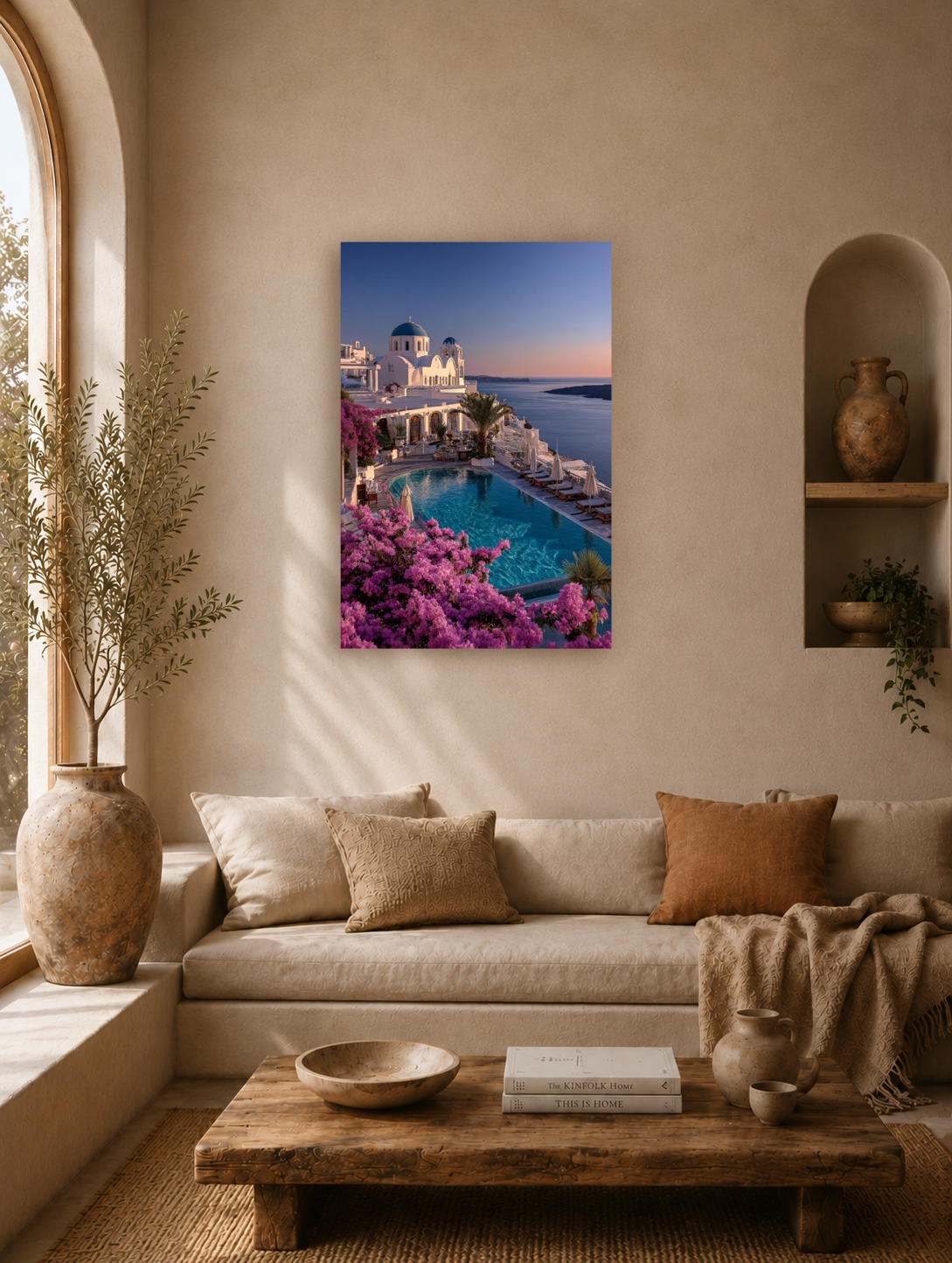 Santorini sunset poster above a linen sofa in a living room with a wooden bench and warm walls