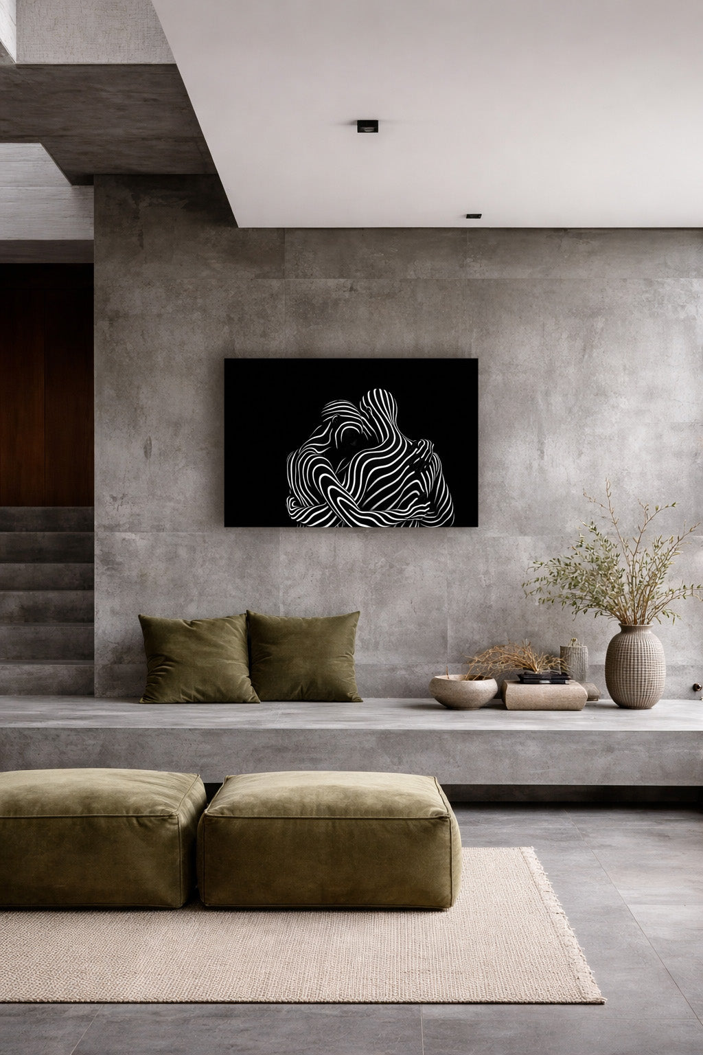 The abstract poster above a beige sofa in a minimalist concrete living room
