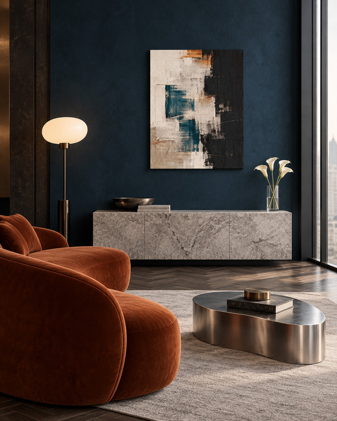 Teal, black and cream abstract canvas on a dark teal wall above a stone console, beside a rust-colored armchair.