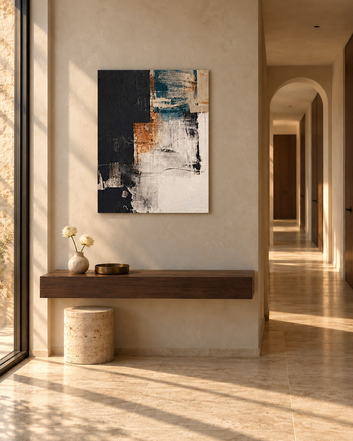 Abstract canvas in teal, terracotta and black above a floating wooden console in a sunlit hallway
