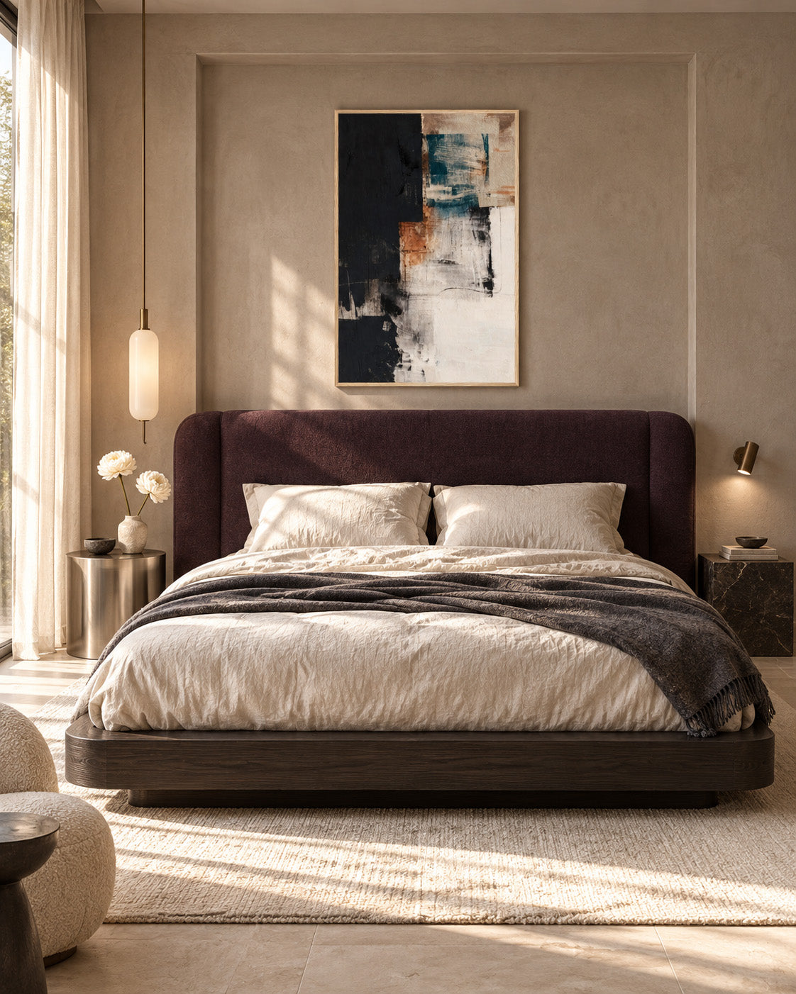 Framed teal and terracotta abstract print centred above an aubergine upholstered bed